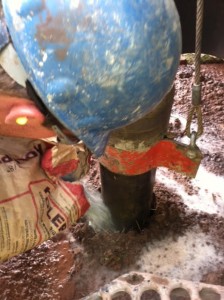 Matt pouring in hole plug to protect bore hole.